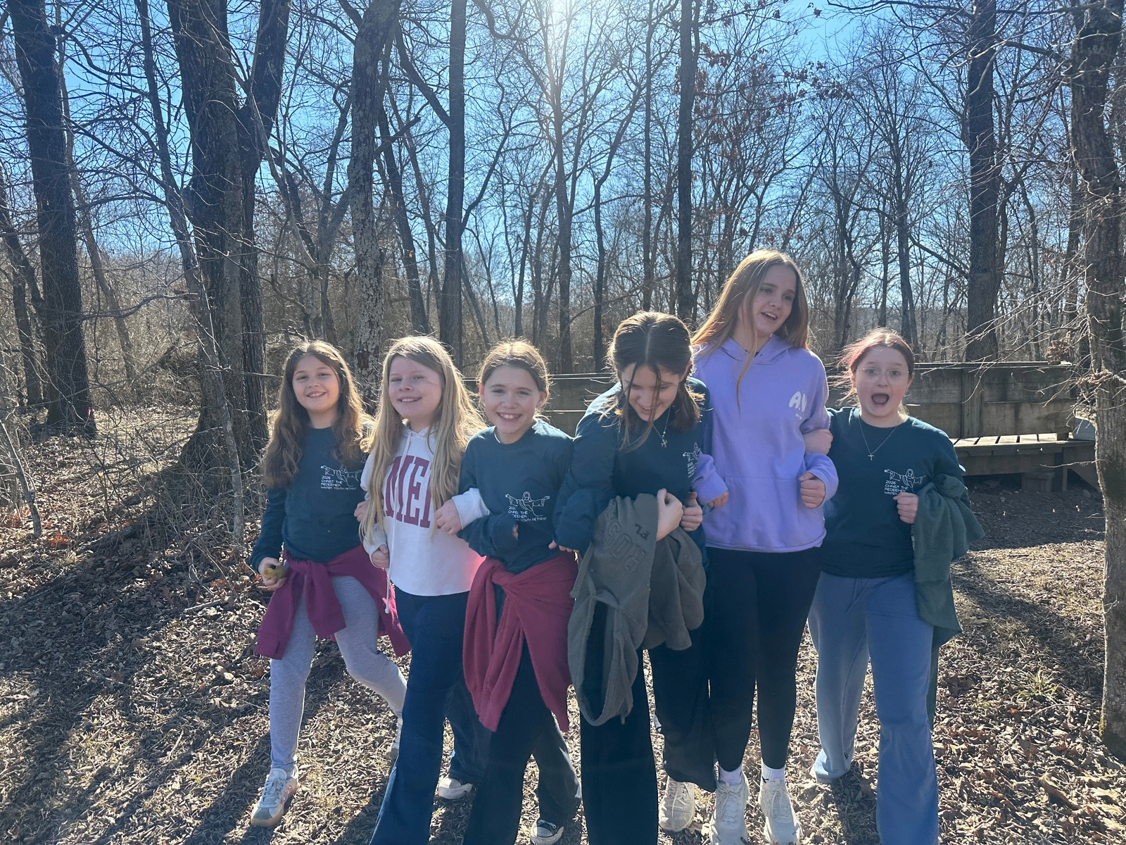 Kids arm-in-arm outdoors at the CTR winter youth retreat
