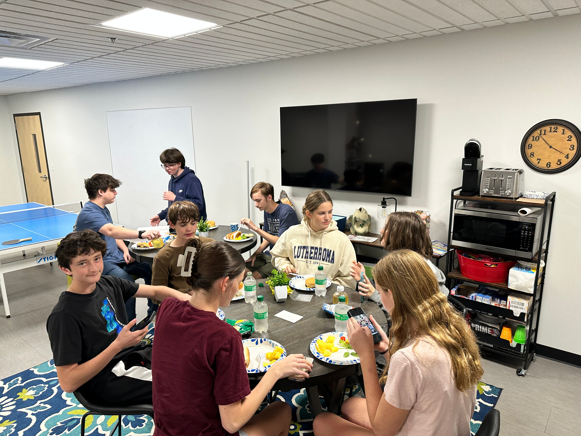 Youth gathered around a table at CTR U