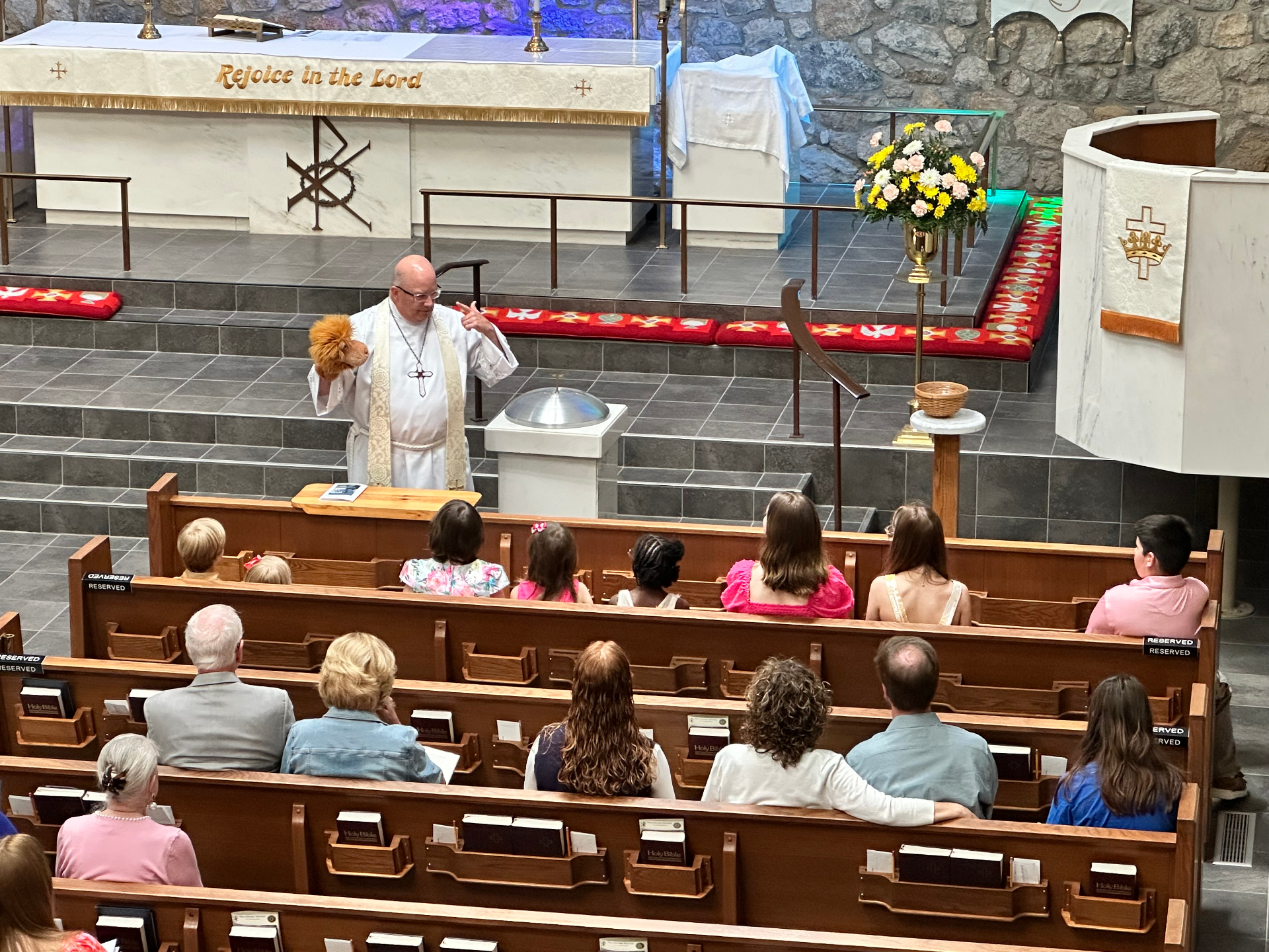 Pastor sharing the children's message during worship